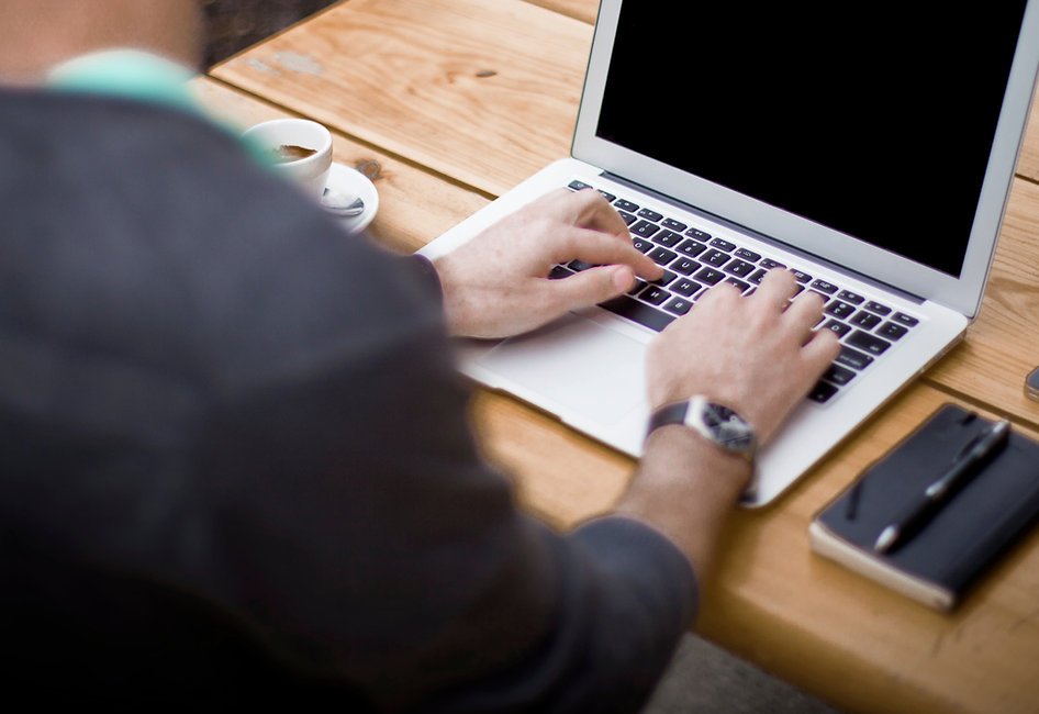 Typing on laptop